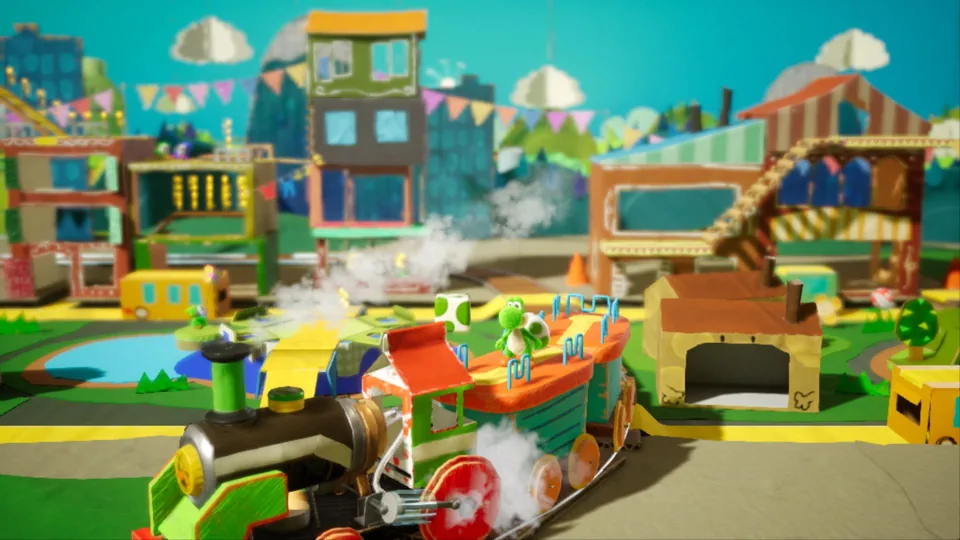 Yoshi in einer aus Pappe und Alltagsmaterialien gestalteten Spiellandschaft.